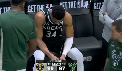 星空官网-字母哥在替补席神情落寞，脚部已被缠上厚厚绑带